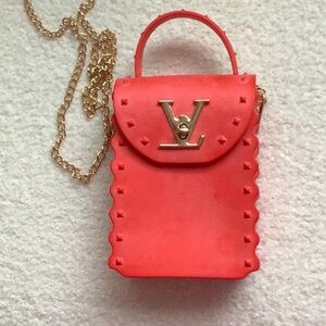 This bag is adorable. Super fun. Gold LV on front. Detachable Gold Chain.